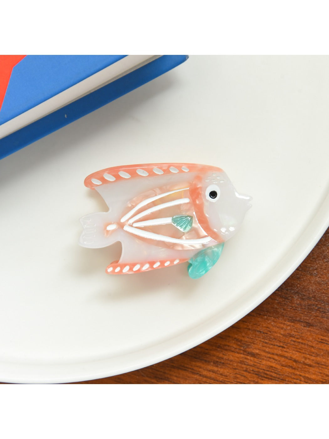 Beau tropical fish acetate hair clip angled to show fish tail and fin details
