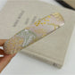 Detailed view of fabric texture and embroidery on Gifty flower headband