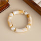 Lovra vintage beaded link bracelet paired with casual outfit on model