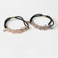 Model wearing Gifty chic beaded hair tie styled in a ponytail
