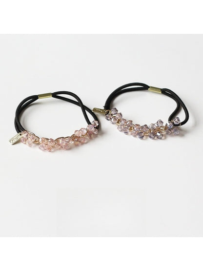 Model wearing Gifty chic beaded hair tie styled in a ponytail