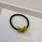 Gifty cartoon puppy hair tie displayed alongside matching accessories