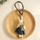 Bunny keychain attached to a backpack zipper pull