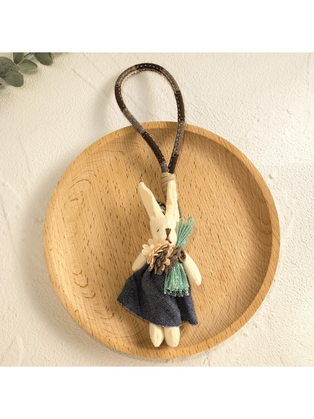 Bunny keychain attached to a backpack zipper pull