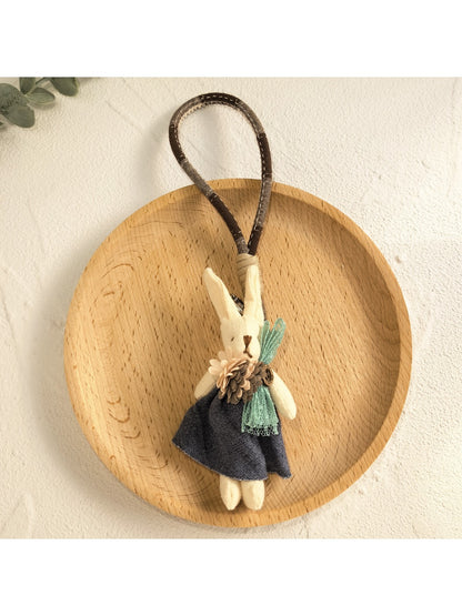 Bunny keychain attached to a backpack zipper pull