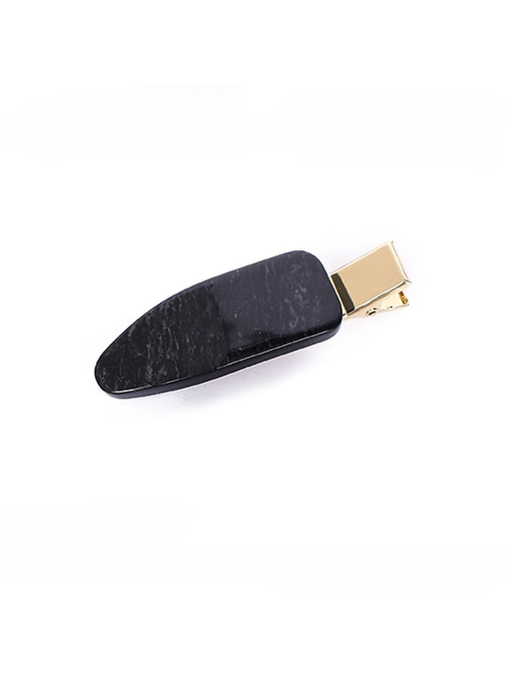 Beau vintage textured hair clip photographed with complementary accessories
