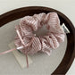 Gifty Sweet Bow Stripe Scrunchie displayed alongside matching hair accessories