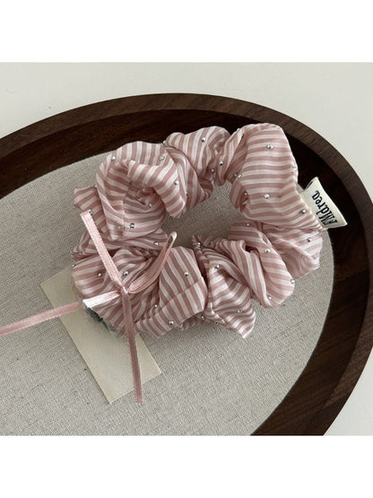 Gifty Sweet Bow Stripe Scrunchie displayed alongside matching hair accessories