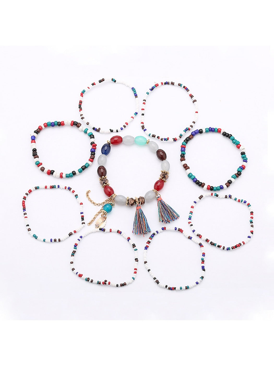 Close-up of Lovra bracelet showing detailed beaded design and gold tassel pendant