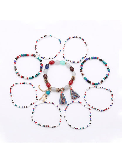 Close-up of Lovra bracelet showing detailed beaded design and gold tassel pendant