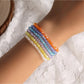 Close-up of Lovra stylish layered beaded bracelet with mixed metal and stone beads