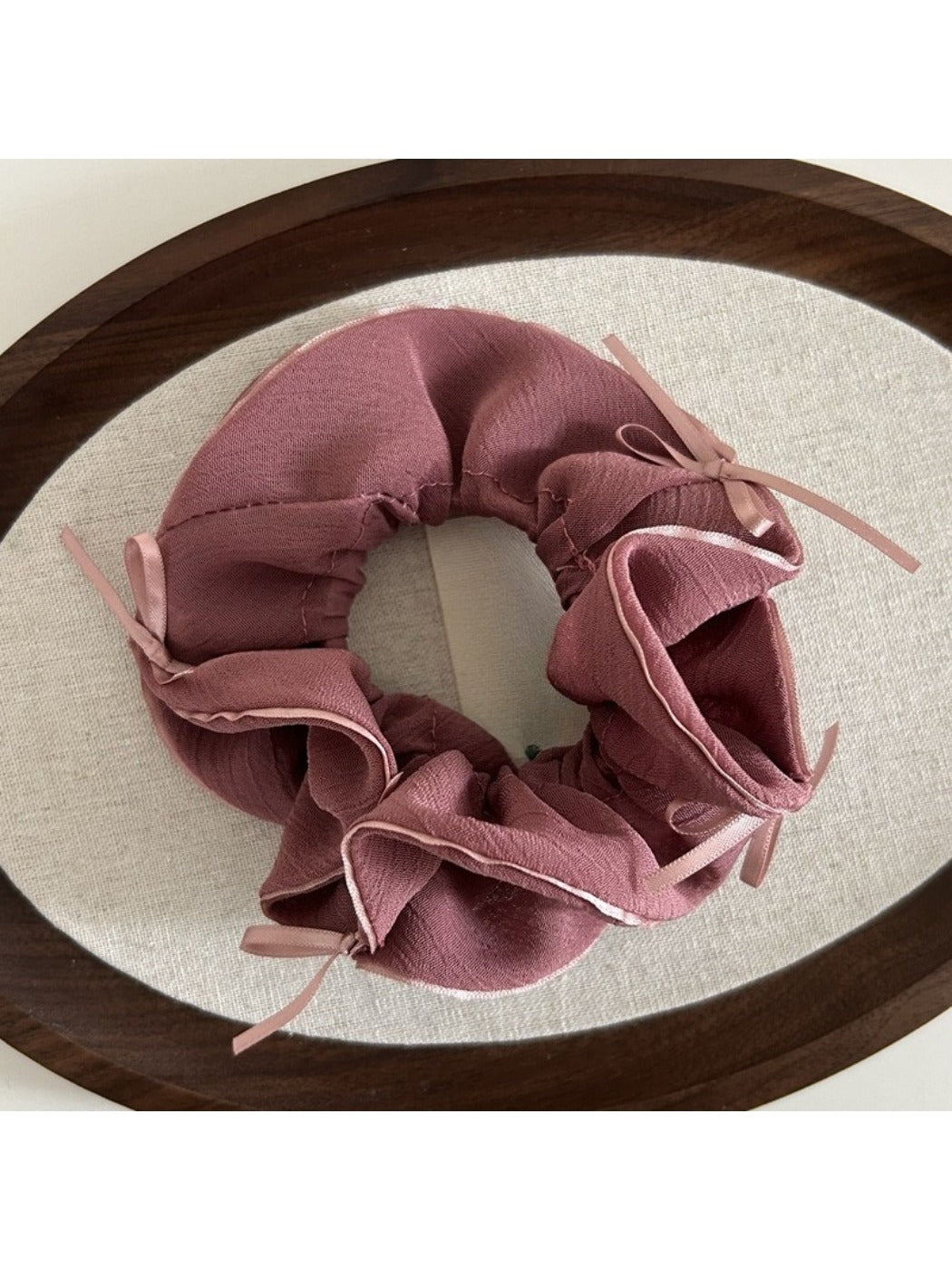 Gifty scrunchie packaged in clear box with branding visible on white background