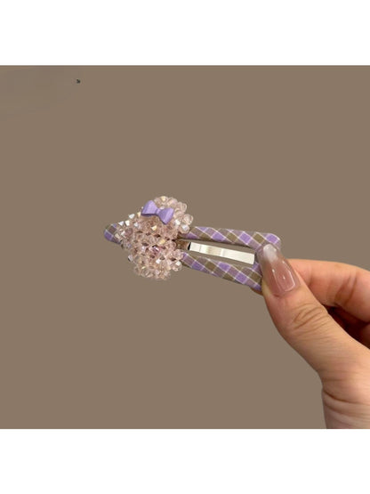 Plaid beaded heart hair clip styled in blonde hair