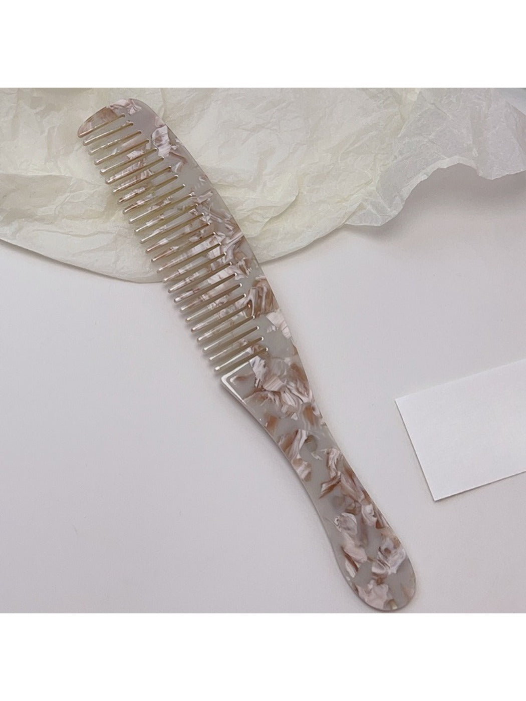 Camerow long handle hair comb placed on wooden surface with natural lighting