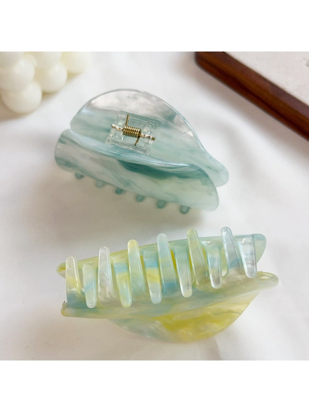 Side view of Beau hair claw clip highlighting clasp mechanism and cloud print