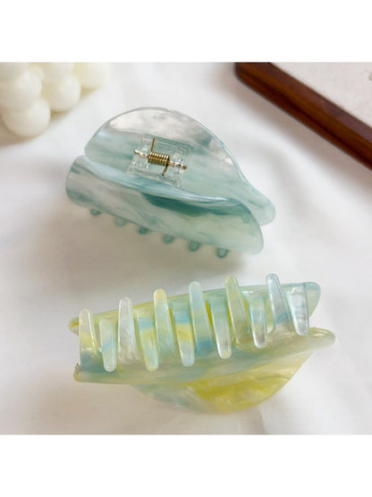 Side view of Beau hair claw clip highlighting clasp mechanism and cloud print