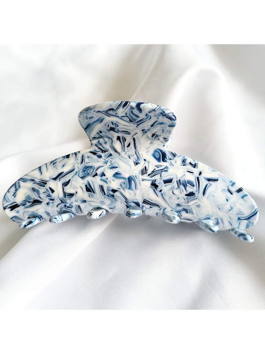 Beau vintage acetate claw clip angled to show glossy finish and color variations
