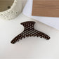 Beau hair clip styled in model's hair with visible polka dot design