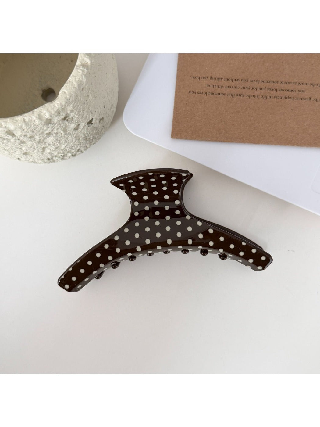 Beau hair clip styled in model's hair with visible polka dot design
