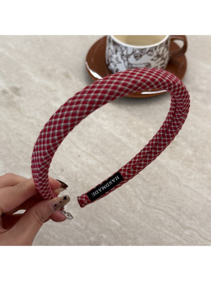 Gifty chic minimalist plaid headband folded to show inner lining and stitching