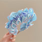 Top view of Gifty ruffle pleated fabric headband highlighting fabric details