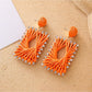 Pair of raffia square shape drop earrings with gold-tone hooks