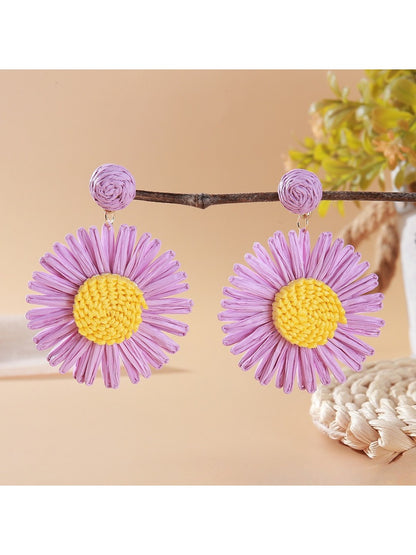 Vintage sunflower earrings styled with casual summer outfit on a model