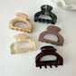 Close-up of Beau claw clip showing detailed openwork pattern and curved shape