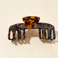 Beau claw clip styled in hair, securing medium-length brown hair