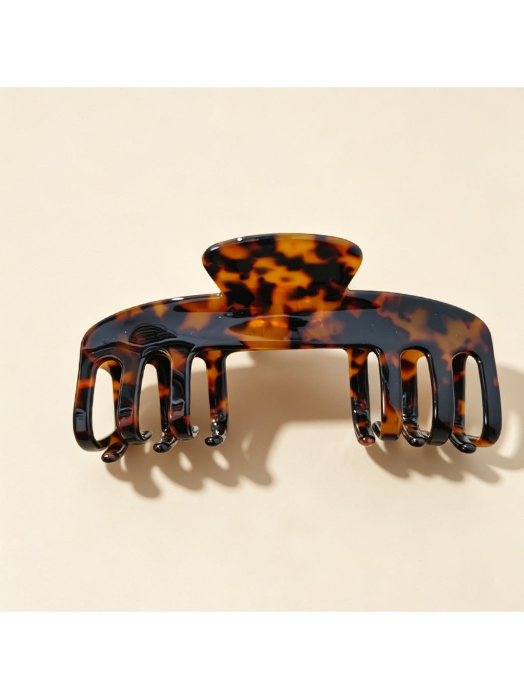 Beau claw clip styled in hair, securing medium-length brown hair