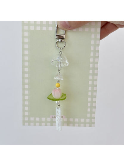 Keychain with lotus flower wind chime attached to a set of keys