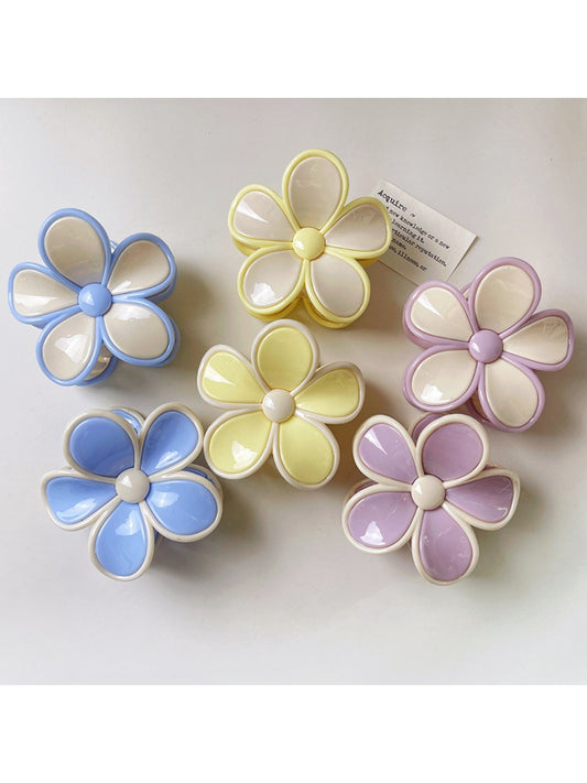 Beau color block flower shaped claw clip in pastel pink and cream on white background