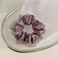 Gifty satin tulle scrunchie styled with casual outfit on model