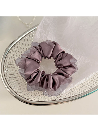 Gifty satin tulle scrunchie styled with casual outfit on model