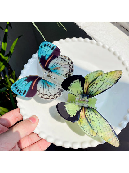 Close-up of Beau butterfly hair claw clip showing curved wings and clasp