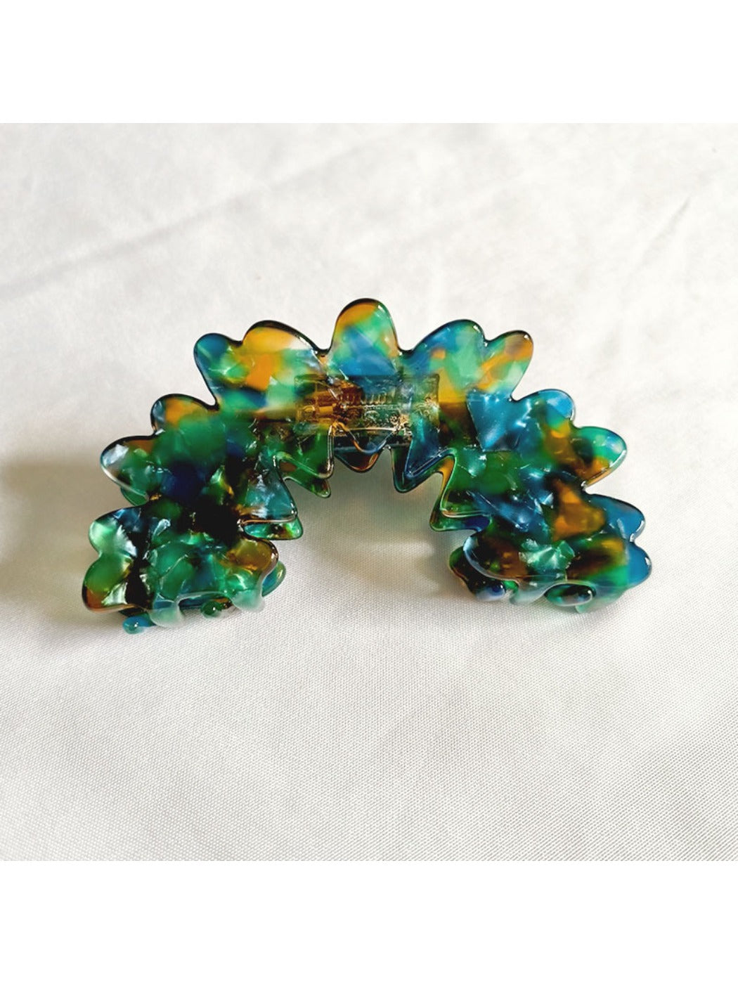 Beau Wave Cloud Shaped Claw Clip clipped onto hair with wave pattern visible
