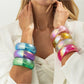 Lovra bangle bracelet worn on wrist with minimalist outfit