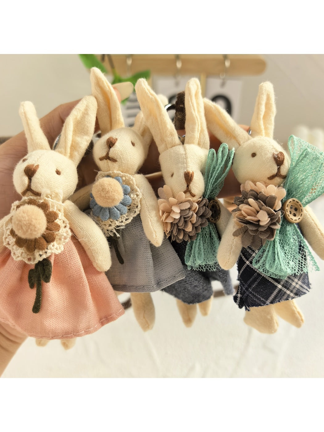 Side view of the minimalist bunny keychain showing its thin profile