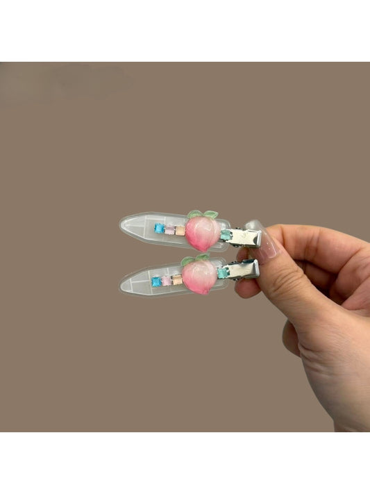 Beau hair clip with cute peach pattern on a light background