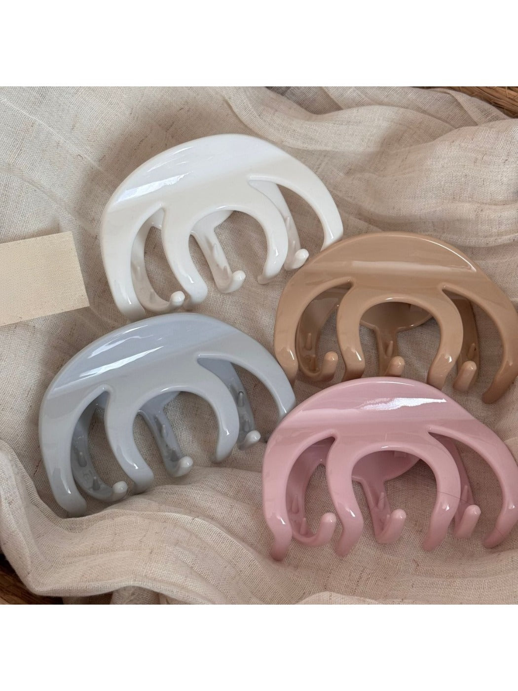 Beau refined smooth surface hair clip in matte black, close-up view