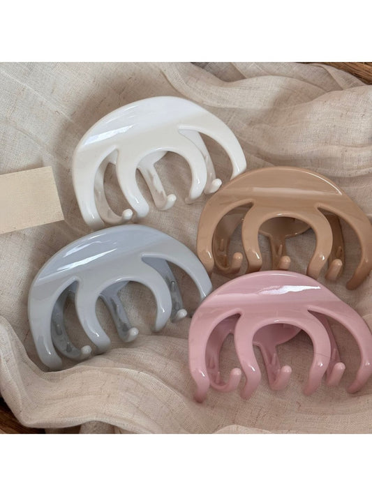 Beau refined smooth surface hair clip in matte black, close-up view