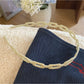 Gifty acetate chain style headband styled with casual outfit on model