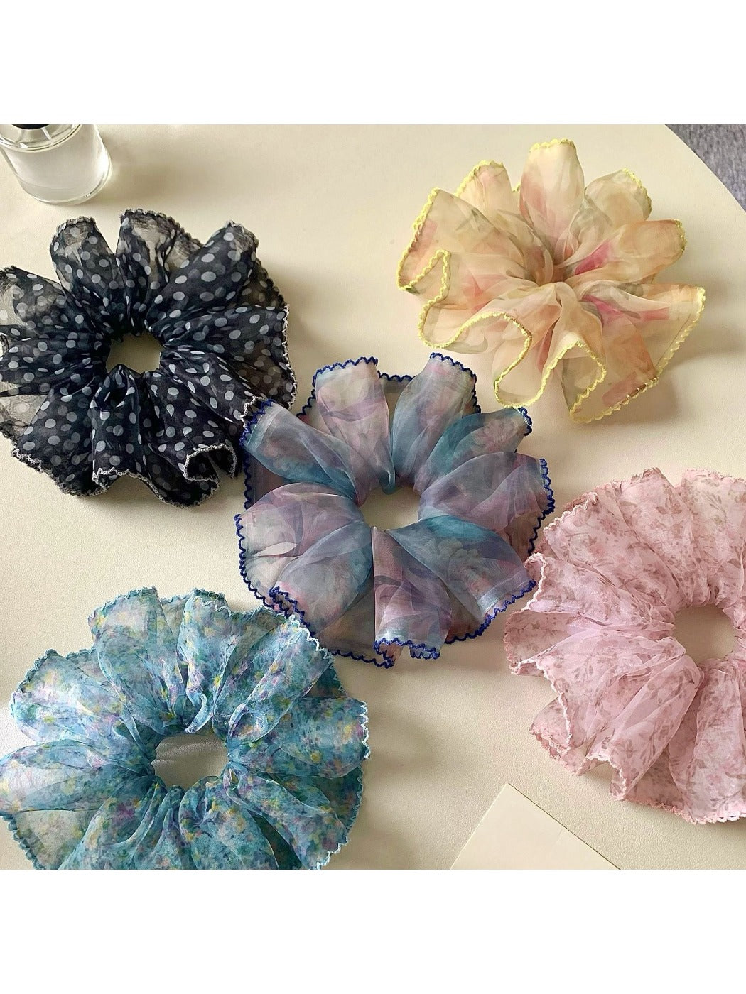Gifty floral scrunchie displayed on a white background showing fabric texture