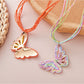 Close-up of raffia butterfly pendant with detailed weaving on necklace