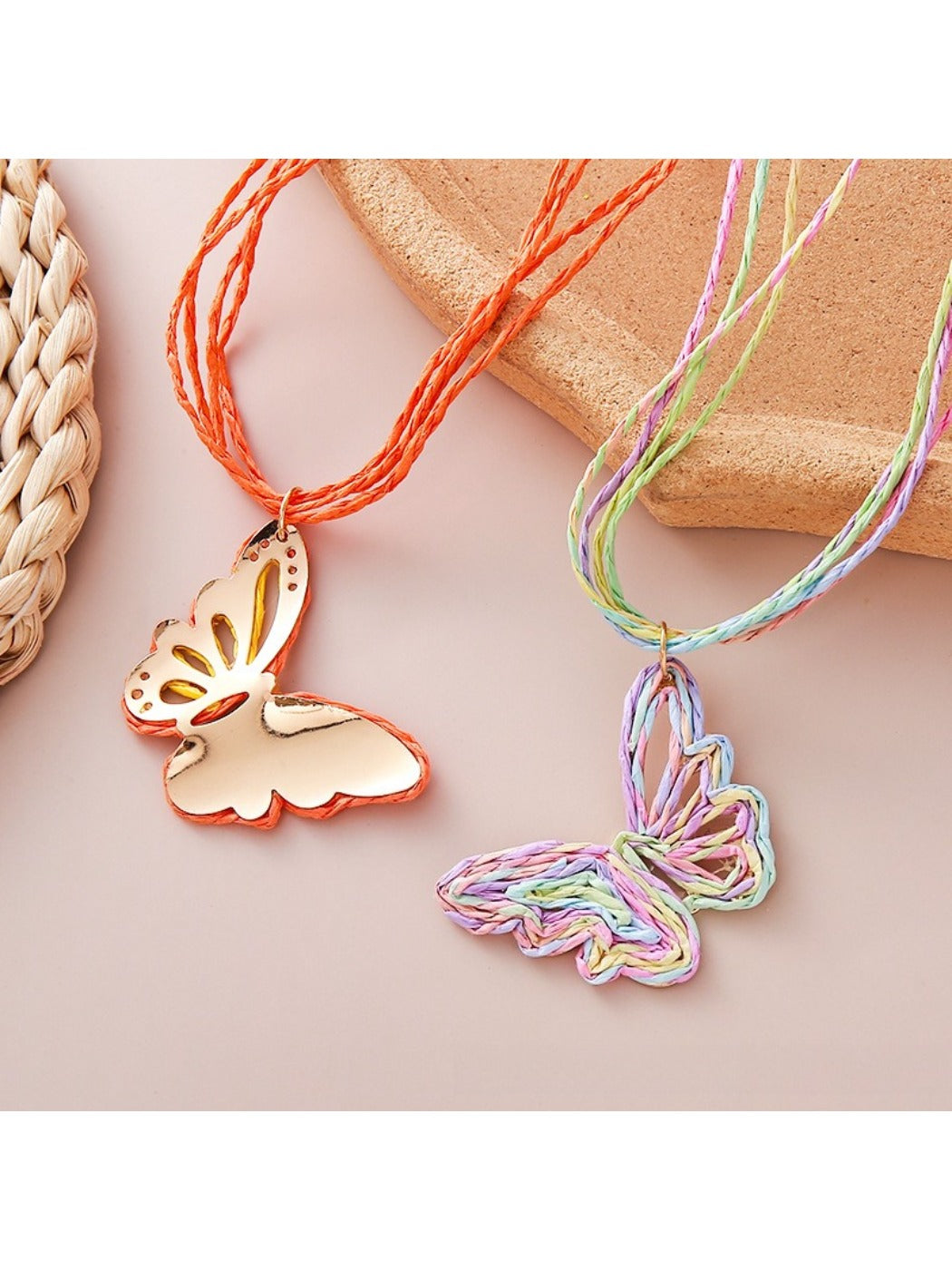 Close-up of raffia butterfly pendant with detailed weaving on necklace