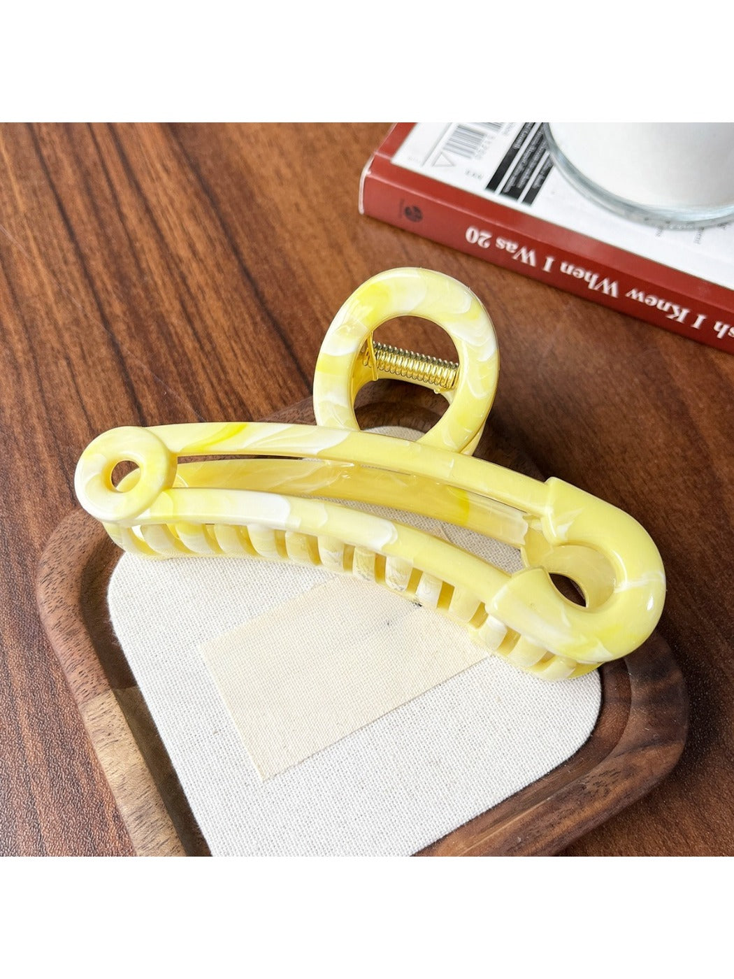 Beau gold paperclip claw clip displayed open to show spring hinge