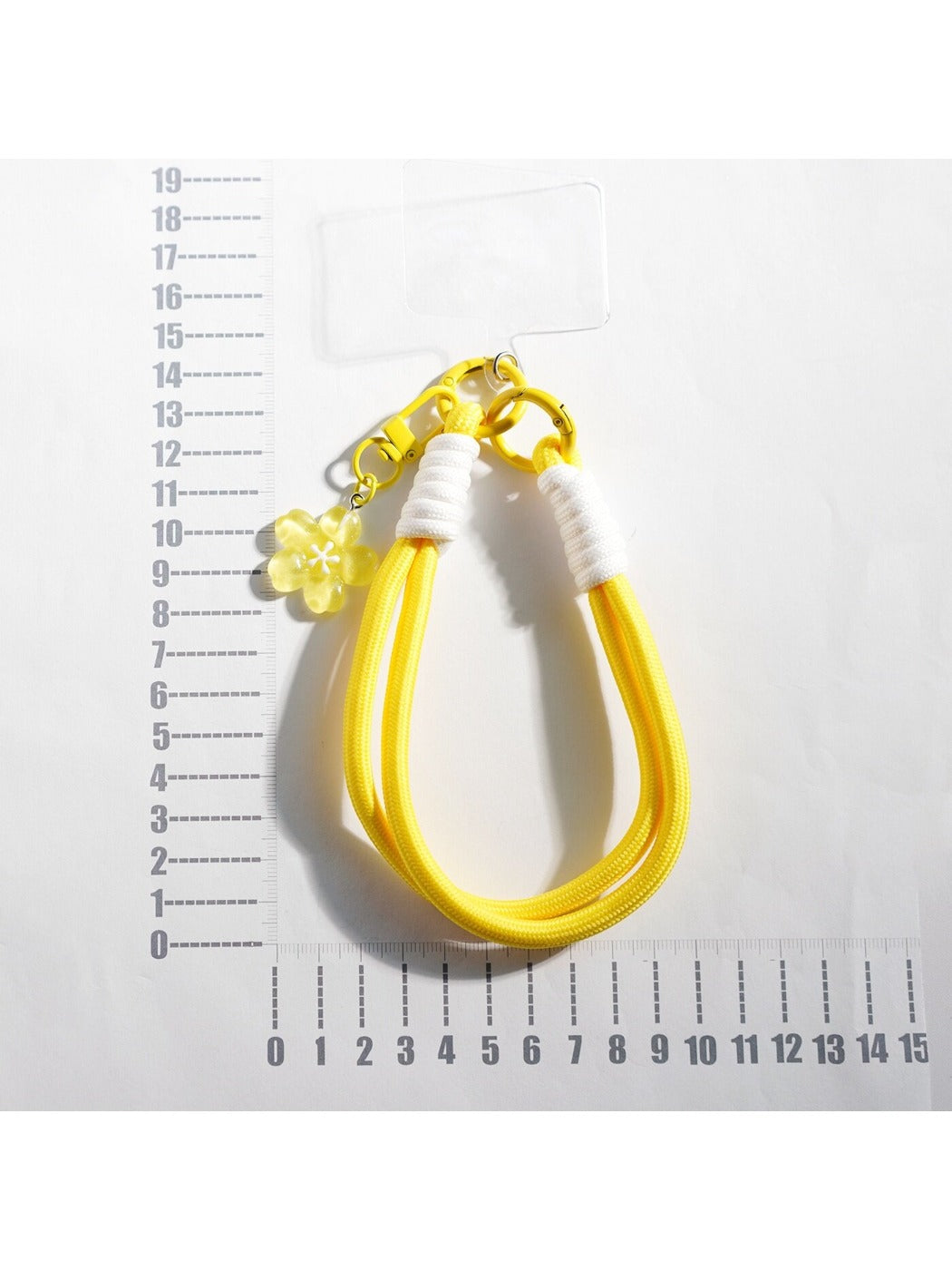 Close-up of the colorful braided rope forming a flower shape on the keychain