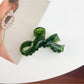 Beau delicate bow hair claw clip shown from angled perspective