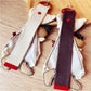 Side view of Keypus fabric patchwork keychain displaying layered fabric pieces and metal ring