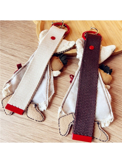 Side view of Keypus fabric patchwork keychain displaying layered fabric pieces and metal ring